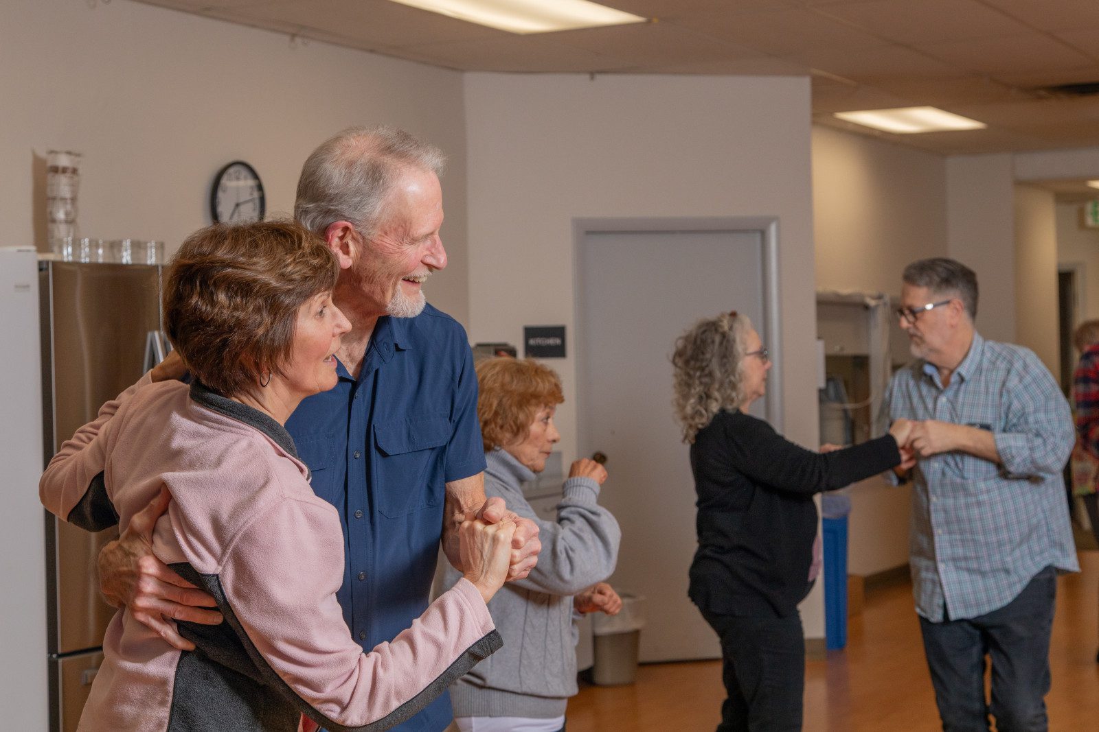 Dance class at the center with several partners dancing