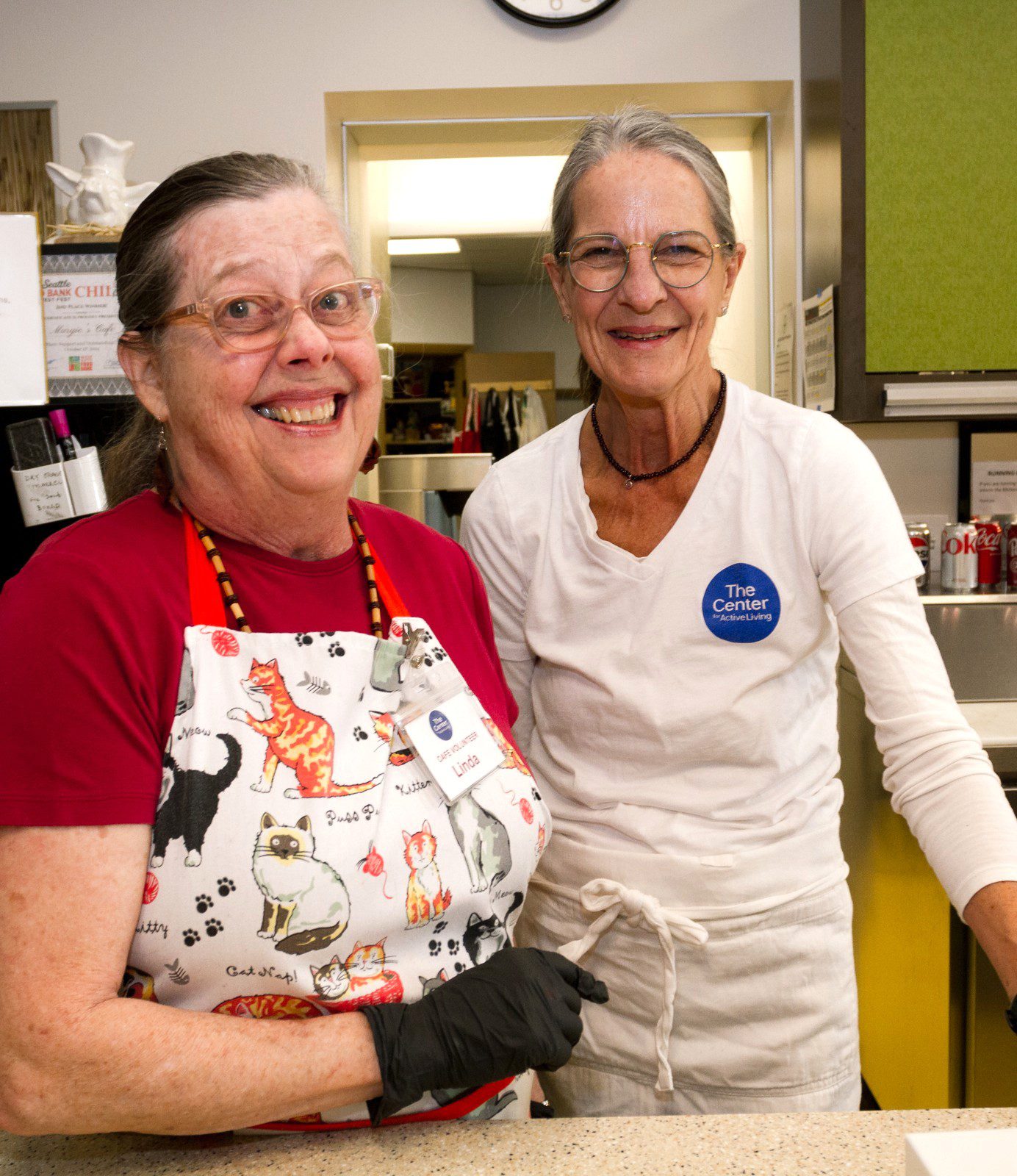 Two volunteers at the Margie's Cafe counter